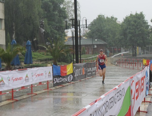 Matej finishing in the downpour